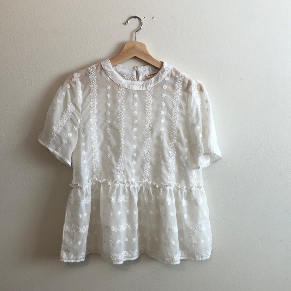 White peplum embroidered top
